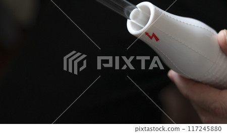 Close up shot of the high frequency comb tool for hair and scalp treatment. 117245880