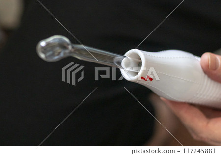 Close up shot of the high frequency comb tool for hair and scalp treatment. 117245881