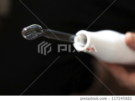 Close up shot of the high frequency comb tool for hair and scalp treatment. 117245882