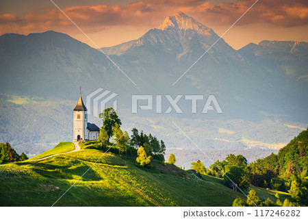 Jamnik, Slovenia - Aerial view of the beautiful hilltop church, amazing golden sunset over Kamnik - Savinja Alps, Skofja Loka 117246282