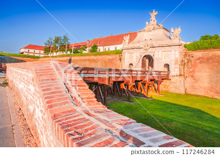 Alba Iulia, Romania. Baroque architectural gate of the stonewalled fortified Alba Carolina, Transylvania. 117246284