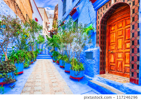 Chefchaouen, Morocco. Blue staircases and decorated walls, typical Medina in North Africa. Chefchaouen, Morocco. Blue staircases and decorated walls, typical Medina in North Africa. 117246296