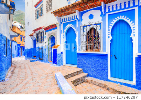 Chefchaouen, Morocco. Blue staircase and decorated walls, typical Medina in North Africa. Chefchaouen, Morocco. Blue staircase and decorated walls, typical Medina in North Africa. 117246297