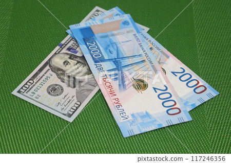 Currency euro and dollars. Money and finance. Euro banknotes on a green background. 117246356