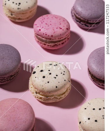 French sweet colorful macaroons on a pink background with a shadow. Flat  lay of concept  food. 117247533