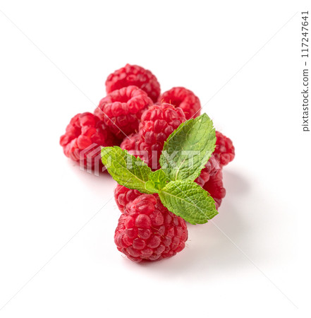 Juicy forest raspberry with mint leaf on a white isolated background. 117247641