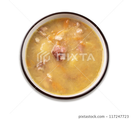Pea soup with smoked ham in black bowl on white isolated. Healthy homemade  food. 117247723