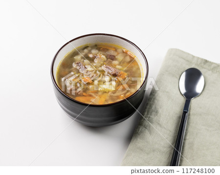 Traditional Russian soup with pickled cucumbers. Pickle with pearl barley and meat Traditional Russian soup with pickled cucumbers. Pickle with pearl barley and meat 117248100