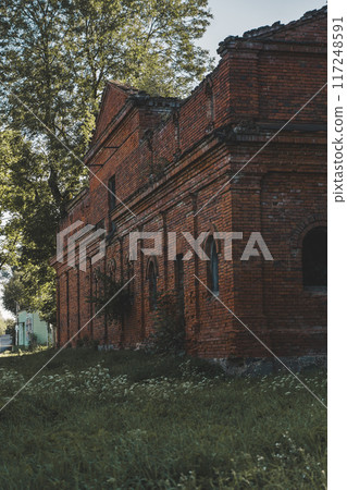 A dilapidated brick stable building. 19th century buildings A dilapidated brick stable building. 19th century buildings 117248591