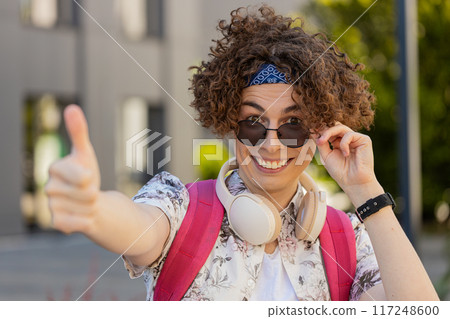 Happy young man tourist showing thumbs up like sign positive something good positive feedback Happy young man tourist showing thumbs up like sign positive something good positive feedback 117248600