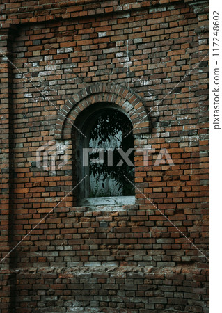 A small window in a brick house. The stable. 19th century buildings A small window in a brick house. The stable. 19th century buildings 117248602