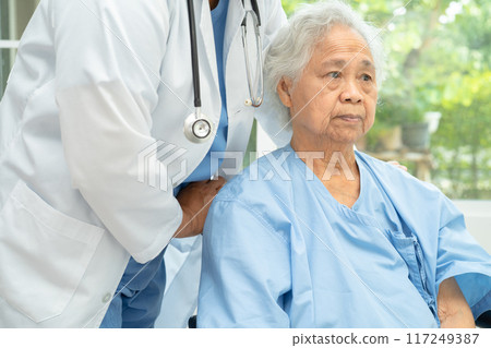 Doctor help and care Asian senior woman on wheelchair at hospital. Doctor help and care Asian senior woman on wheelchair at hospital. 117249387