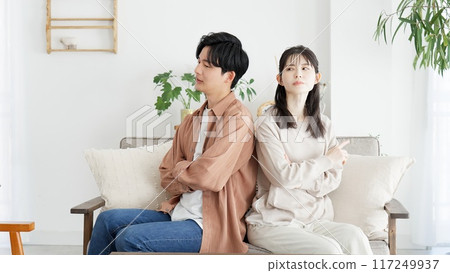A couple in a living room A couple in a living room 117249937