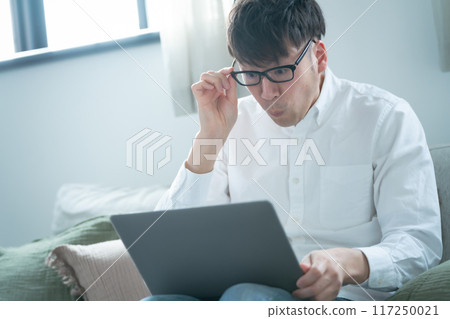 Middle-aged man panicking worried Middle-aged man panicking worried 117250021