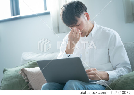 Middle-aged man panicking worried 117250022