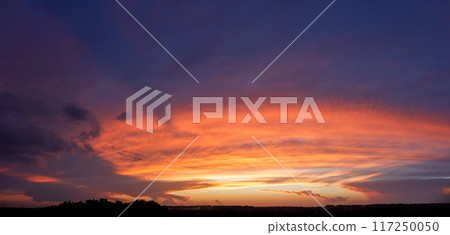 Vibrant Sunset Over Horizon at Twilight 117250050