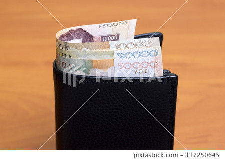 Old Venezuelan bolivar in the black wallet 117250645