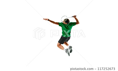 Endurance and skill. Dynamic image of competitive man, badminton athlete in motion with racket, playing isolated on white background Endurance and skill. Dynamic image of competitive man, badminton athlete in motion with racket, playing isolated on white background 117252673