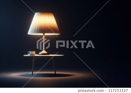 A lamp standing on a table on a dark background. Space for text. A lamp standing on a table on a dark background. Space for text. 117253337