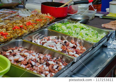 Grilled snacks on a hot plate, takoyaki, flour-based dishes, hot plate, food stall, festival 117253811