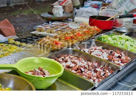 Grilled snacks on a hot plate, takoyaki, flour-based dishes, hot plate, food stall, festival 117253813