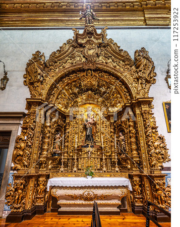 The golden interior of the Carmelite church Igreja do Carmo at Faro in Portugal 117253922