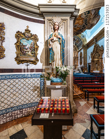 The golden interior of the Carmelite church Igreja do Carmo at Faro in Portugal 117253933