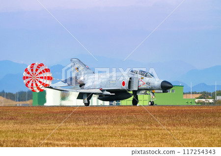 An Air Self-Defense Force F-4EJ Kai fighter jet landing with its drag chute extended An Air Self-Defense Force F-4EJ Kai fighter jet landing with its drag chute extended 117254343