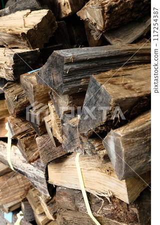 Firewood piled up after chopping 117254387