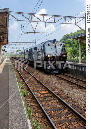 Cruise train Nanatsuboshi in Kyushu photographed at Akune Station (vertical composition) 117254432