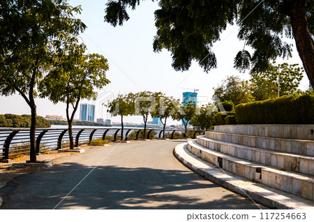 embankment of the city of Donetsk along the Kalmius river. Multi-storey buildings rise. A bridge crosses the river connecting part of the city. High quality photo embankment of the city of Donetsk along the Kalmius river. Multi-storey buildings rise. A bridge crosses the river connecting part of the city. High quality photo 117254663