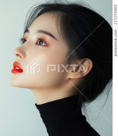 Elegant profile of a korean woman with styled hair and bold red lips against a soft background 117255065