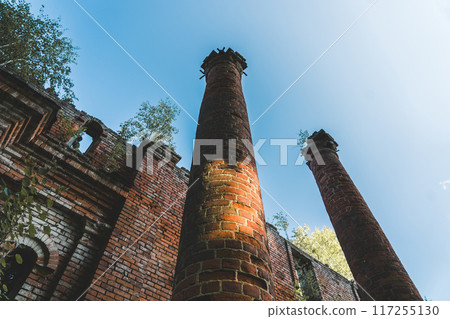 Two old, dilapidated, brick columns, bottom-up view Two old, dilapidated, brick columns, bottom-up view 117255130