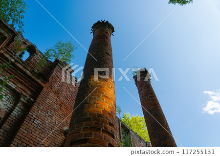 Two old, dilapidated, brick columns, bottom-up view Two old, dilapidated, brick columns, bottom-up view 117255131