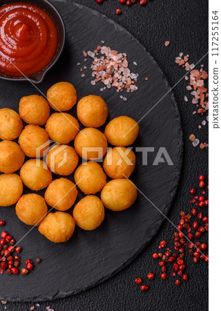 Cheese or potato balls breaded with salt, spices and herbs Cheese or potato balls breaded with salt, spices and herbs 117255164