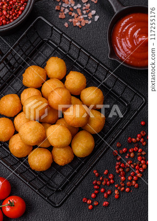 Cheese or potato balls breaded with salt, spices and herbs Cheese or potato balls breaded with salt, spices and herbs 117255176