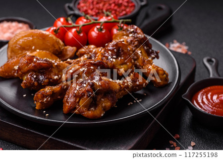 Delicious crispy baked chicken wings in teriyaki sauce 117255198
