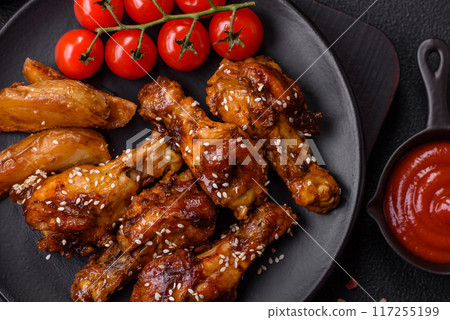 Delicious crispy baked chicken wings in teriyaki sauce 117255199