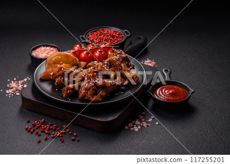 Delicious crispy baked chicken wings in teriyaki sauce 117255201