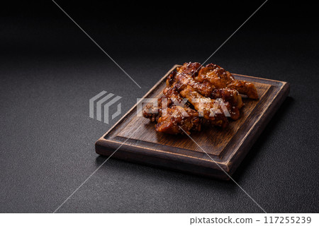 Delicious crispy baked chicken wings in teriyaki sauce 117255239
