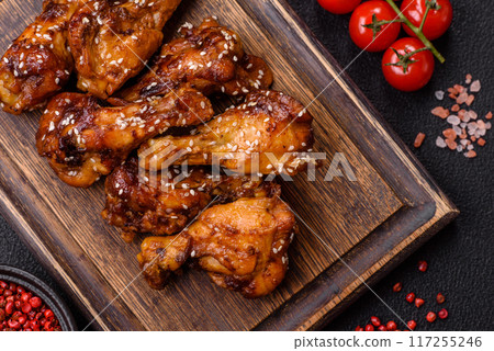 Delicious crispy baked chicken wings in teriyaki sauce Delicious crispy baked chicken wings in teriyaki sauce 117255246