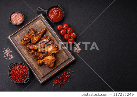 Delicious crispy baked chicken wings in teriyaki sauce Delicious crispy baked chicken wings in teriyaki sauce 117255249