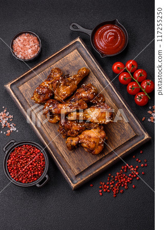 Delicious crispy baked chicken wings in teriyaki sauce 117255250