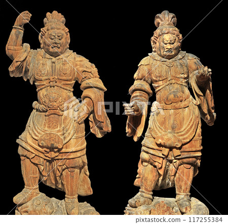 Buddhist statues from ancient Japan isolated on black background 117255384