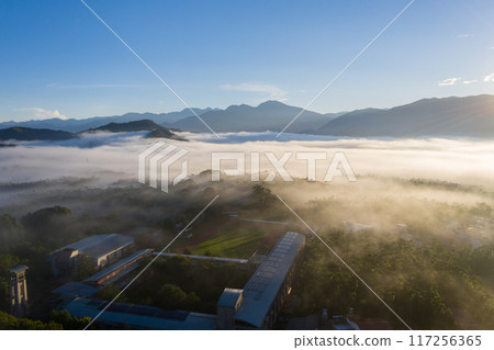 morning cloudy landscape with mist 117256365