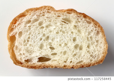 Cross section of French bread on white background Cross section of French bread on white background 117258445