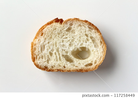 Cross section of French bread on white background Cross section of French bread on white background 117258449
