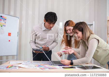 A team of designers helps develop the application system. Brainstorm ideas for making ux ui to develop programs A team of designers helps develop the application system. Brainstorm ideas for making ux ui to develop programs 117258860