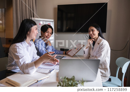 Group of Asian businessmen discuss to plan analysis of company marketing strategy and brainstorm with report documents in office. 117258899