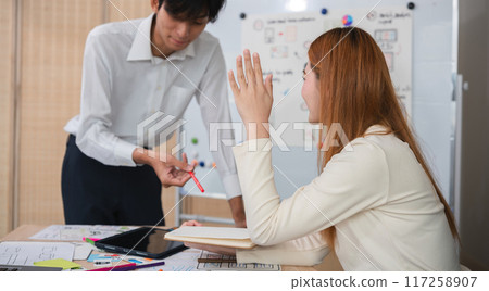 A team of designers helps develop the application system. Brainstorm ideas for making ux ui to develop programs 117258907